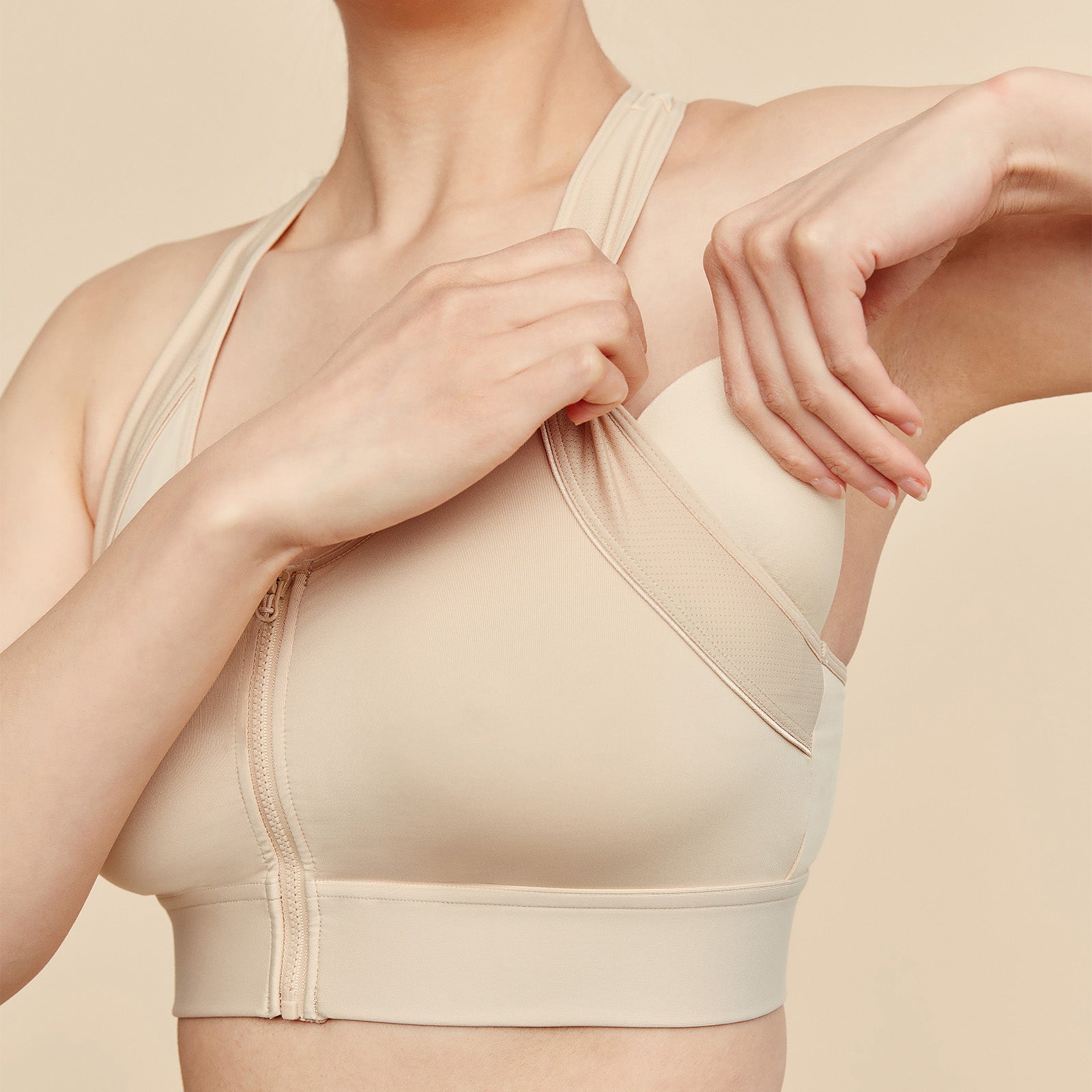 Picture of Model Inserting Breast Form into Sports Bra Pocket